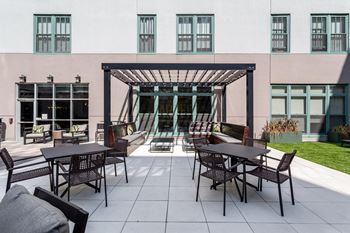 Outdoor patio with tables and chairs